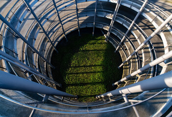 Aerial or vertical view of the spiral ascent ramp driveway of big car park in Cologne Germany....