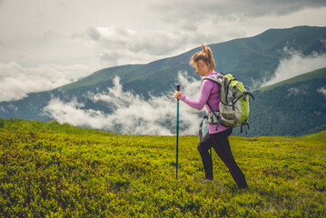 Young woman hiking in the mountains