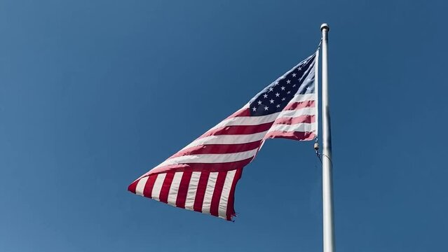 breeze blowing american flag waving sunny wind blue sky windy america flagpole