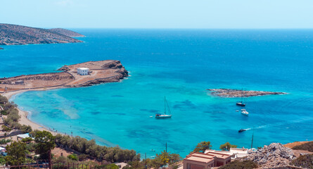 Sailing yachts or boats at anchor stop on Scninoussa island or any Greek Island in Mediterranean or...