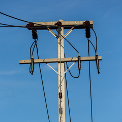 Electric Pole Power Lines And Wires With Blue Sky Background