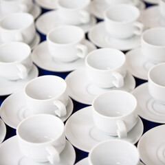 roup of empty Many rows of white ceramic coffee or tea cups