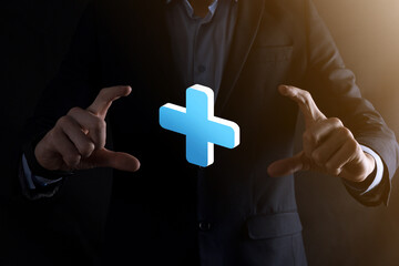 Businessman hold 3D plus icon, man hold in hand offer positive thing such as profit, benefits,...