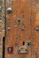 Detail of wooden ancient door with old iron rivets