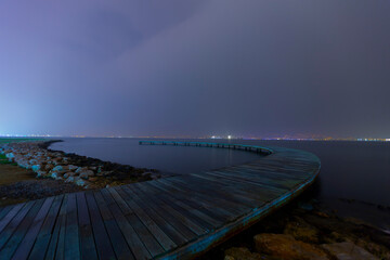 The boomerang-shaped pier was photographed using the long exposure technique.