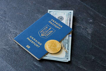 Hundred US dollar bill inside Ukrainian passport and bitcoin. Bribe during the war