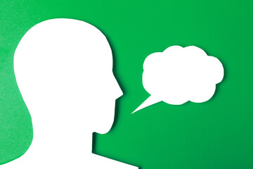  paper face and speech bubble on colorbackground copy space for text, communication, symbolic- Image