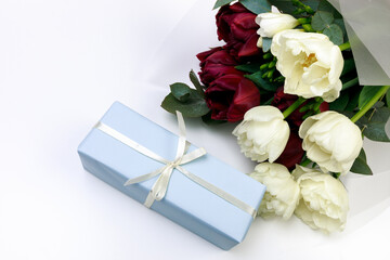  tulips  and gift box on white background. Stylish soft image of spring flowers. Happy womens day. Happy Mothers day- Image
