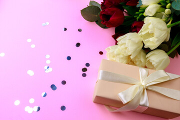  tulips  and gift box on pink background. Stylish soft image of spring flowers. Happy womens day. Happy Mothers day- Image