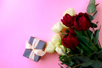  tulips  and gift box on pink background. Stylish soft image of spring flowers. Happy womens day. Happy Mothers day- Image