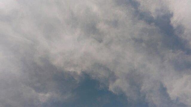 overhead clouds motion overcast blue sky atmosphere cumulus cloud beneath wind season