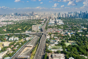 Metro Manila, Philippines - The SLEX Skyway going towards the Metro Manila cityscape and skyline.