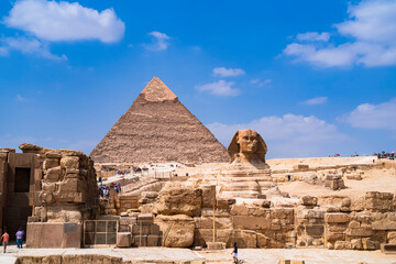 The great Sphinx of Giza whose back is dominated by the pyramid of Cheops. Photo taken in Cairo,...
