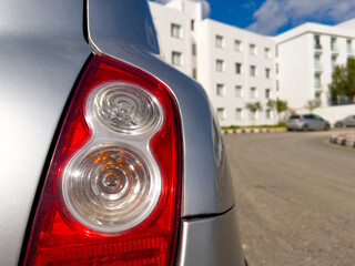 close up red car headlight with road, cars and automotives