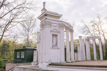 Obraz premium Lazienki or Royal Baths park in Warsaw in Poland. Royal Palace on the Water in Lazienki Park, Warsaw, Palace on the water in the Royal Baths in Warsaw, Poland