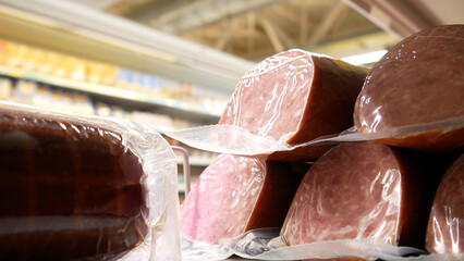 Close-up of delicious sausages on a supermarket fridge shelf