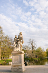Obraz premium Lazienki or Royal Baths park in Warsaw in Poland. Royal Palace on the Water in Lazienki Park, Warsaw, Palace on the water in the Royal Baths in Warsaw, Poland