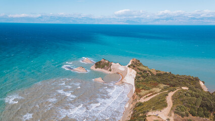 Cape on the island of Corfu from above. Aerial photography of the landscape from a drone. Beautiful views of Greece and the sea.