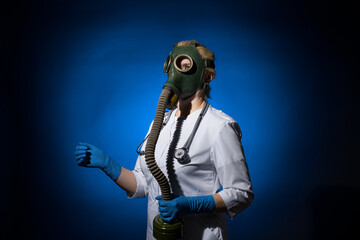 Fototapeta na wymiar doctor woman in a gas mask and gloves goes on a blue background