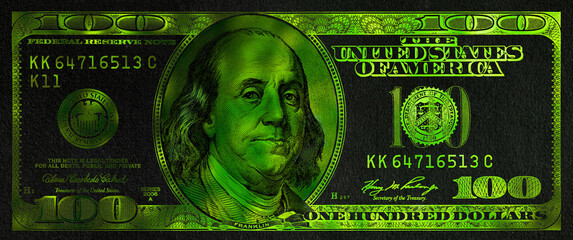 green textured 100 US dollar banknote with black background