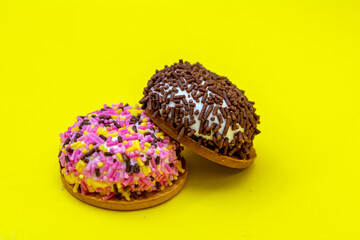 Mcro close up on mrshmellow biscuits with cocoa, vanilla and rainbow flakes