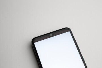a blank smartphone screen close up on the blank background