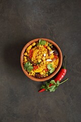 Vegan Moroccan Couscous with Chick Peas, spinach, dried apricots and date fruit. Traditional African Tajine dish. Flat layot