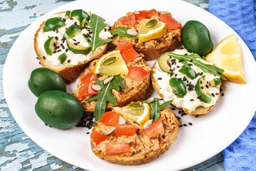 Set of bruschetta with various toppings. Variety of open sandwiches. Assorted small sandwiches