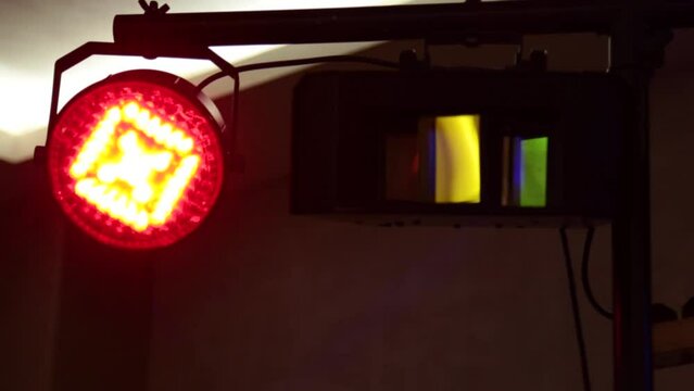 multi-colored lamps flicker close-up. soffits shine in different colors. professional dance floor lighting equipment in clubs at parties