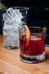 Homemade cocktail on Red Boulevard. glass martini with raspberry cocktail with raspberry alcohol and orange garnish.Cafe advertisement. Bar menu