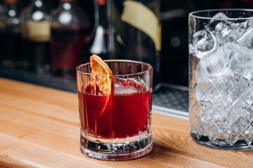 Homemade cocktail on Red Boulevard. glass martini with raspberry cocktail with raspberry alcohol and orange garnish.Cafe advertisement. Bar menu