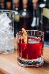 Homemade cocktail on Red Boulevard. glass martini with raspberry cocktail with raspberry alcohol and orange garnish.Cafe advertisement. Bar menu