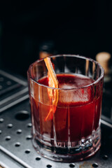 Homemade cocktail on Red Boulevard. glass martini with raspberry cocktail with raspberry alcohol and orange garnish.Cafe advertisement. Bar menu