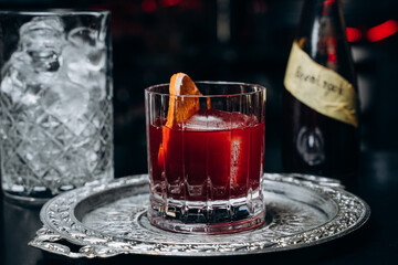 Homemade cocktail on Red Boulevard. glass martini with raspberry cocktail with raspberry alcohol and orange garnish.Cafe advertisement. Bar menu