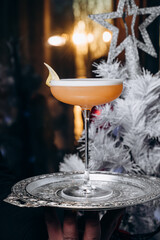 Pisco sour cocktail. Whiskey Sour in Coupe Glass with ice on gray background. Overhead view, copy space. Advertising for cafe. Bar menu.