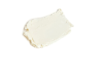 A smear of whipped mascarpone cream cheese isolated on white background
