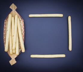 Breadsticks on dark background