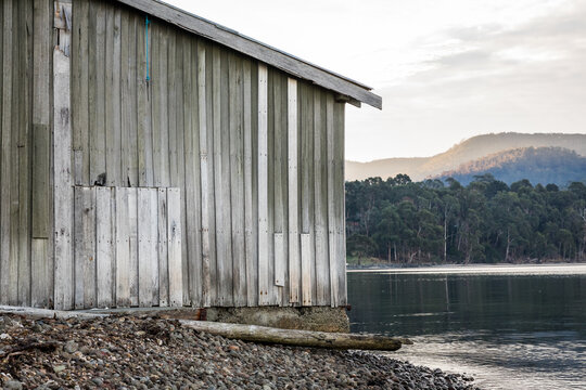 Wooden shack beside water