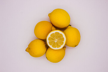 Few ripe lemons on light background