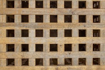Texture of a wooden lattice. Square wooden lattice.