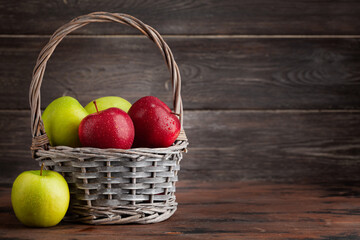 Colorful ripe apple fruits in basket