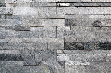 Grunge grey stone wall tiles texture.Wall natural grey stone dirty,dust.Wall and panel marble...