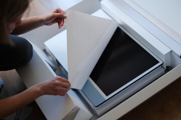 Woman hands unpacking box with modern personal computer
