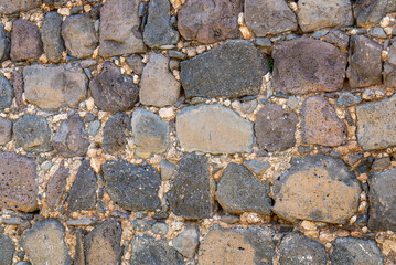Close up of basalt and stone wall at Kohav Hayarden National Park in Israel
