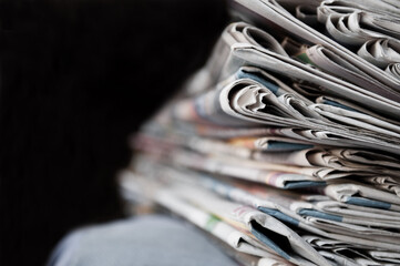 Newspapers folded and stacked on the table. Image shallow depth of field. - 502261833