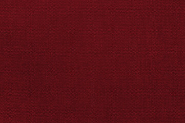 Closeup red color fabric texture. Fabric pattern design or upholstery abstract background.