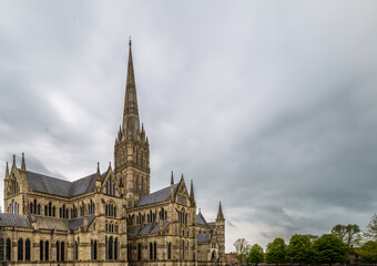 Fototapeta na wymiar Salisbury Cathedral, an Anglican in Wiltshire, UK. The main building was completed in 1258 and the spire, which is the highest in England was built in 1320. Shot in 1st May 2022.