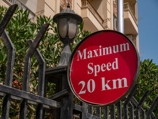 Beautiful red sign with a maximum speed limit of twenty km h. Close-up.