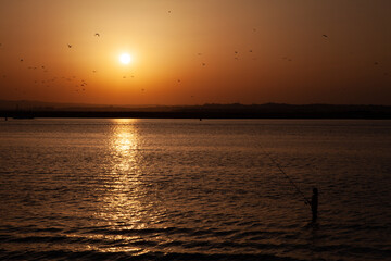 Long shot of a sunset at the beach