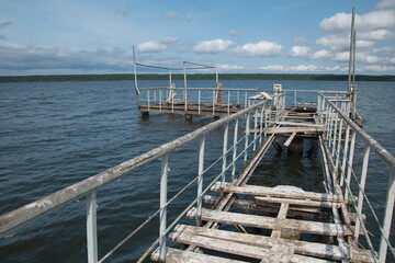 Fototapeta premium an old metal pier with railings on the Volga river. Ulyanovsk